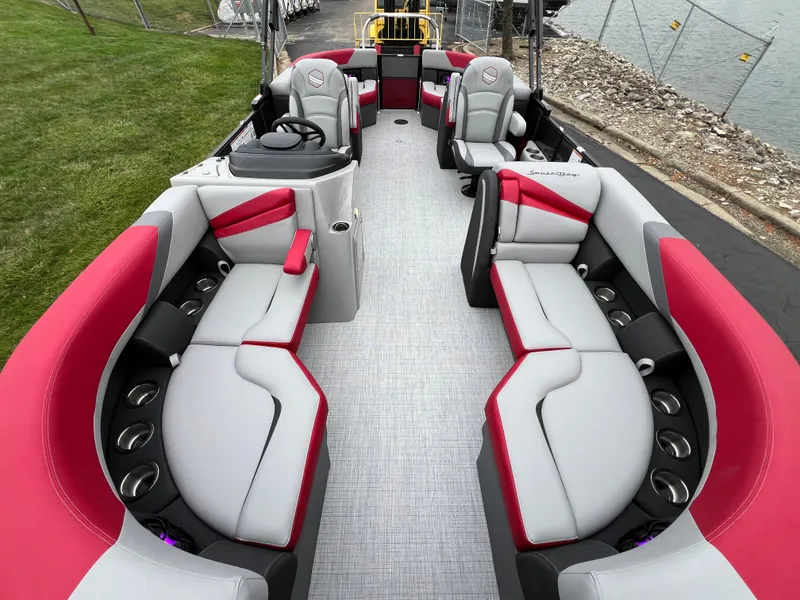 Slide: The Image of 2025 South Bay S222 RS Tri 3.0 pontoon boat with red and gray seating. - 7