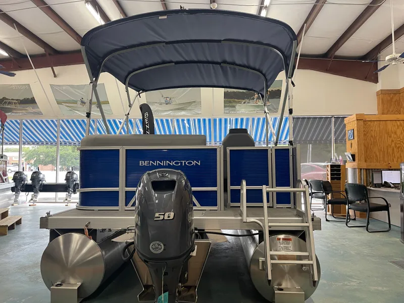Slide: The Image of 2024 Bennington 188SVLSR pontoon boat with Yamaha 50 engine in showroom. - 12