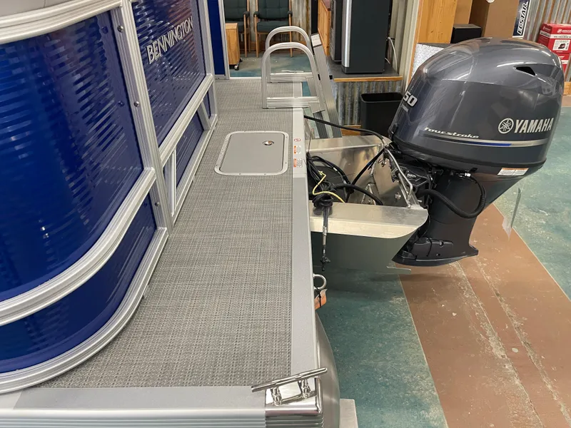 Slide: The Image of 2024 Bennington 188SVLSR pontoon boat with Yamaha outboard motor in showroom. - 24