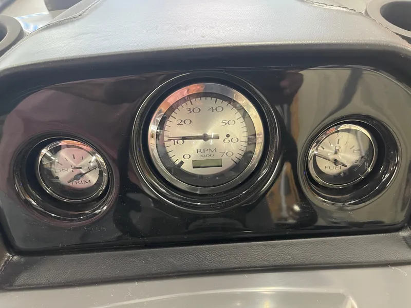 Slide: The Image of Dashboard of 2024 Bennington 188SVLSR with RPM, trim, and fuel gauges. - 37