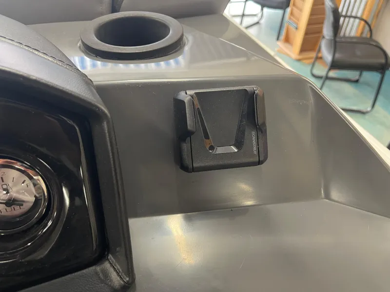 Slide: The Image of Dashboard of 2024 Bennington 188SVLSR with cup holder and fuel gauge. - 39