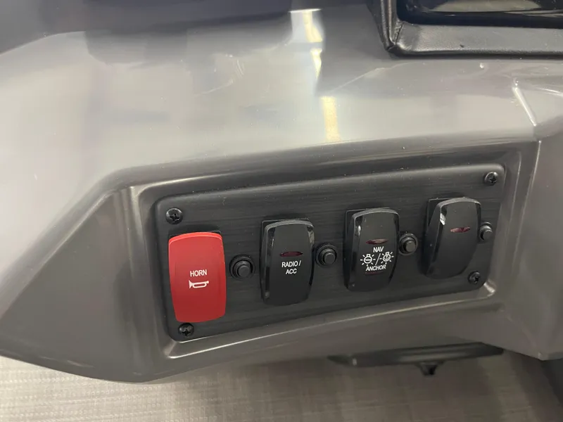 Slide: The Image of Control panel of 2024 Bennington 188SVLSR boat with horn and navigation switches. - 44