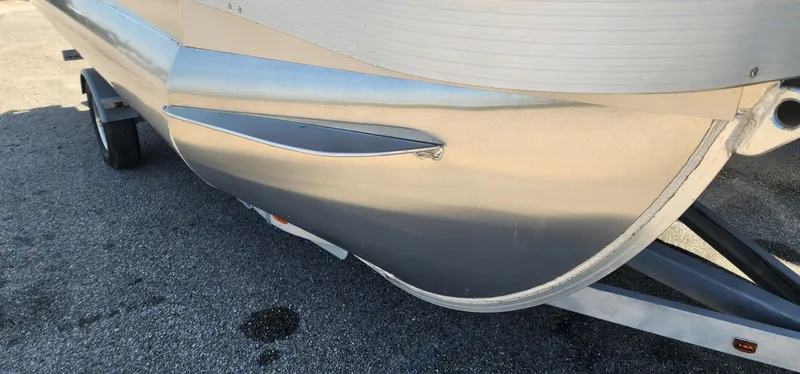 Slide: The Image of 2024 Bennington 20SVFSR pontoon boat on trailer, close-up view. - 11