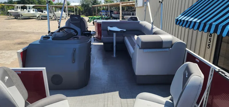 Slide: The Image of 2024 Bennington 20SVFSR pontoon boat interior with seating and helm. - 12
