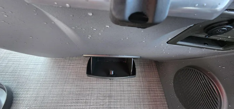 Slide: The Image of 2024 Bennington 20SVFSR interior detail with storage compartment and speaker. - 23