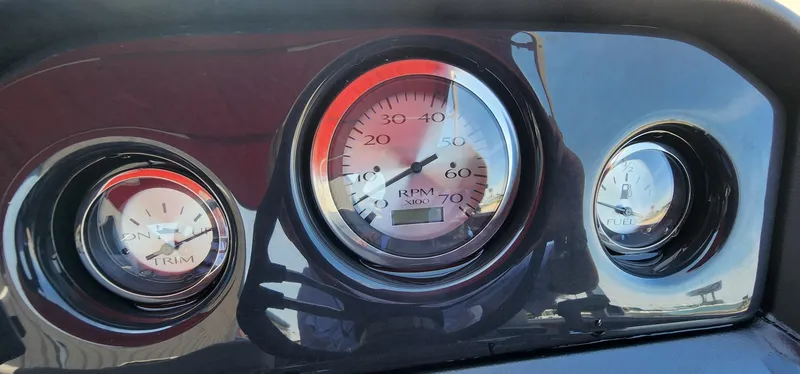 Slide: The Image of Dashboard gauges of 2024 Bennington 20SVFSR boat, showing RPM, trim, and fuel levels. - 25