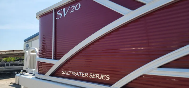 Slide: The Image of 2024 Bennington 20SVFSR Saltwater Series pontoon boat, red exterior detail. - 7