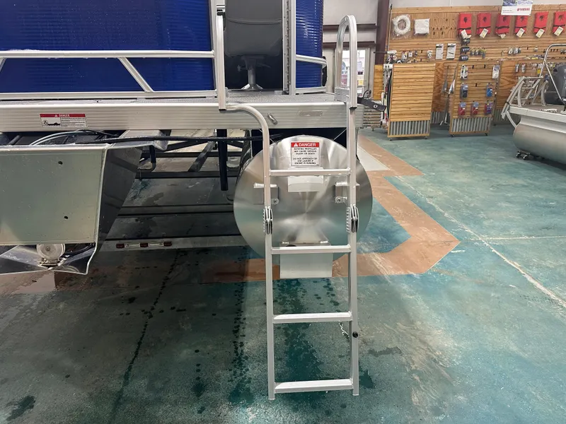 Slide: The Image of 2024 Bennington 20SVLSR pontoon boat with ladder in showroom. - 14