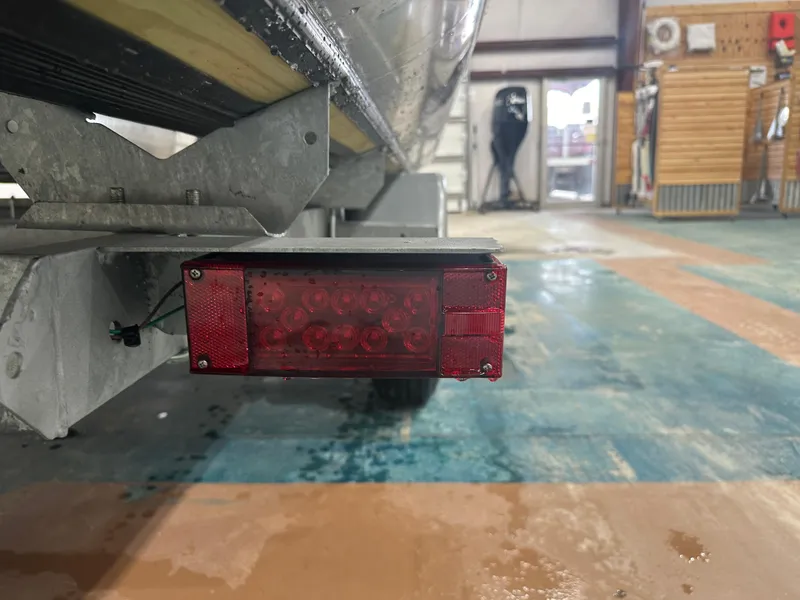 Slide: The Image of 2024 Bennington 20SVLSR trailer light in a workshop setting. - 18