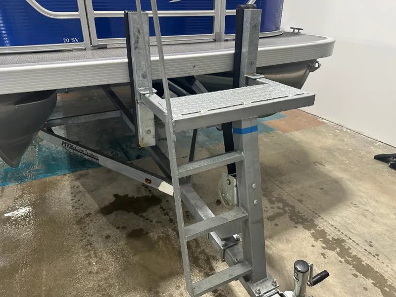 Slide: The Image of 2024 Bennington 20SVLSR pontoon boat on trailer with boarding ladder. - 19