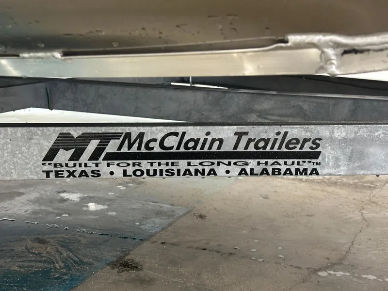 Slide: The Image of McClain Trailers logo on a 2024 Bennington 20SVLSR boat trailer. - 20