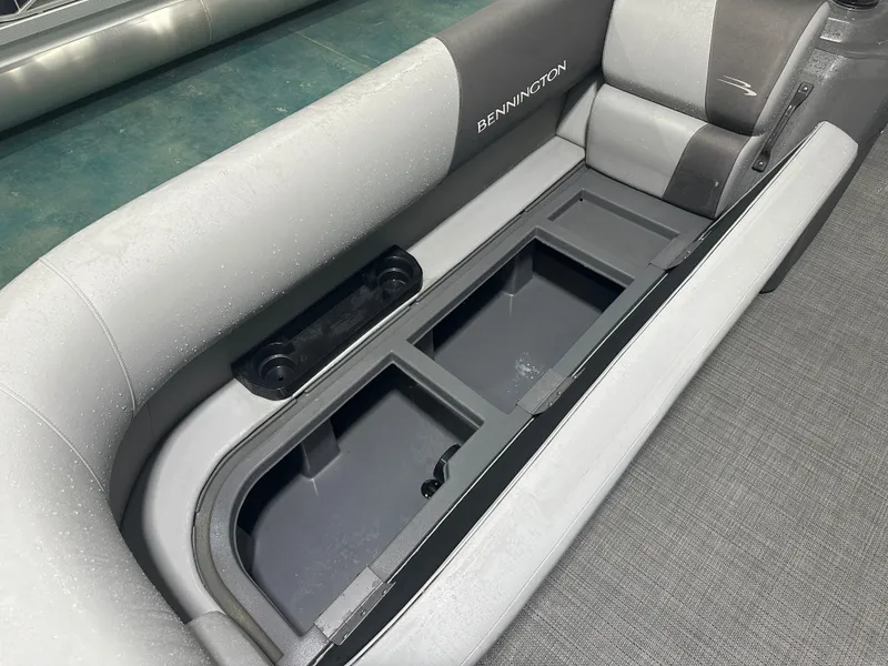 Slide: The Image of 2024 Bennington 20SVLSR boat interior with storage compartment and seating. - 25