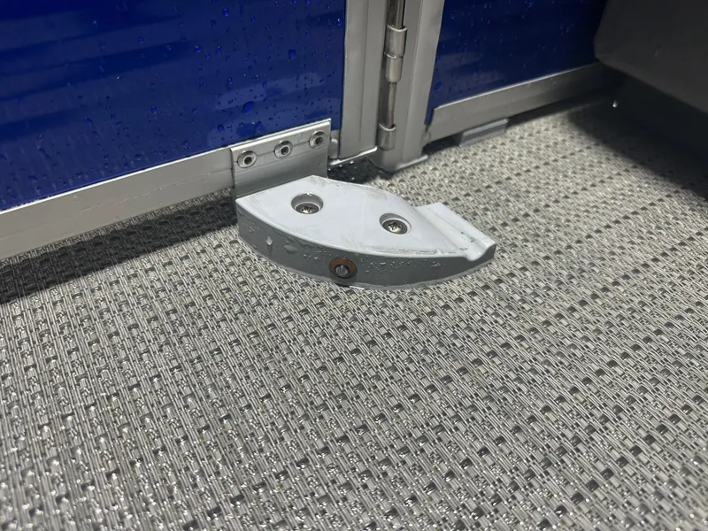 Slide: The Image of 2024 Bennington 20SVLSR boat hinge detail on textured flooring. - 26