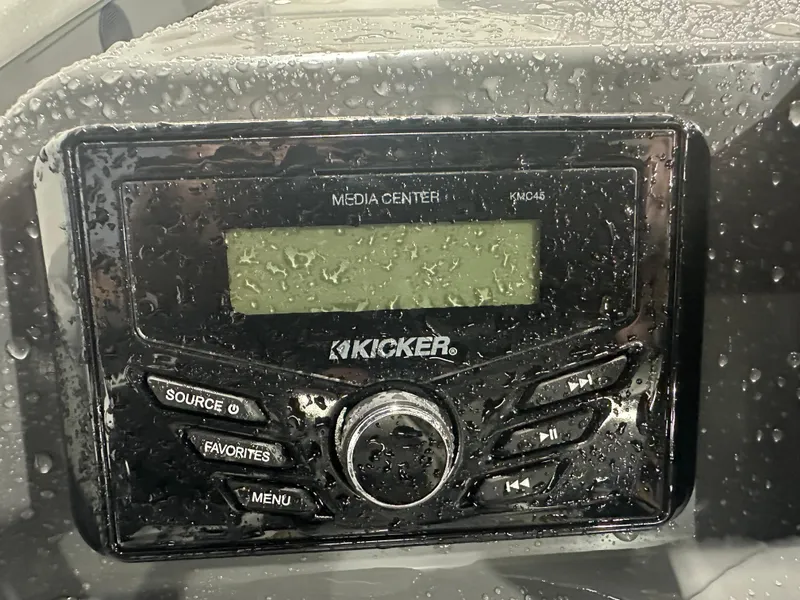 Slide: The Image of Kicker media center in 2024 Bennington 20SVLSR, covered in water droplets. - 29