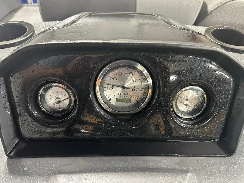 Slide: The Image of Dashboard of 2024 Bennington 20SVLSR boat with gauges and water droplets. - 30