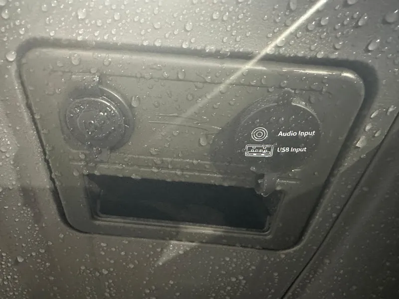 Slide: The Image of 2024 Bennington 20SVLSR audio and USB input panel with water droplets. - 34