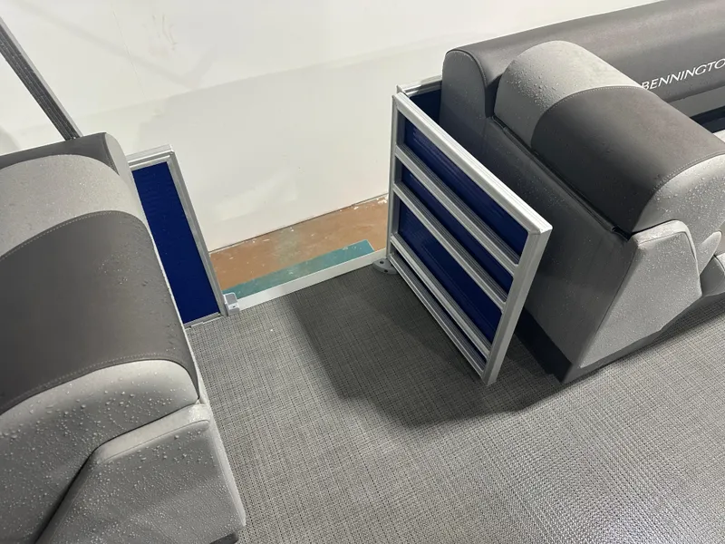 Slide: The Image of 2024 Bennington 20SVLSR boat interior with gray seating and textured flooring. - 41