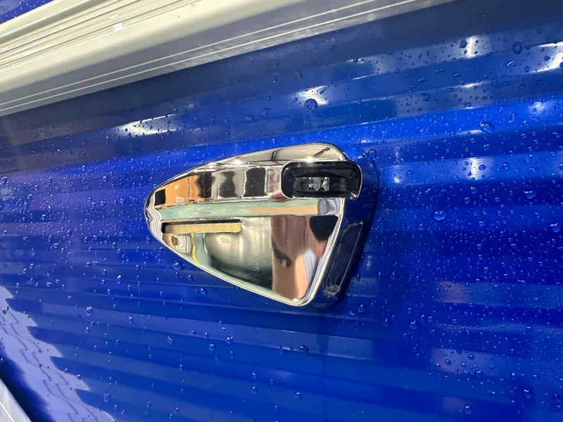 Slide: The Image of Close-up of 2024 Bennington 20SVLSR boat handle on wet blue surface. - 6