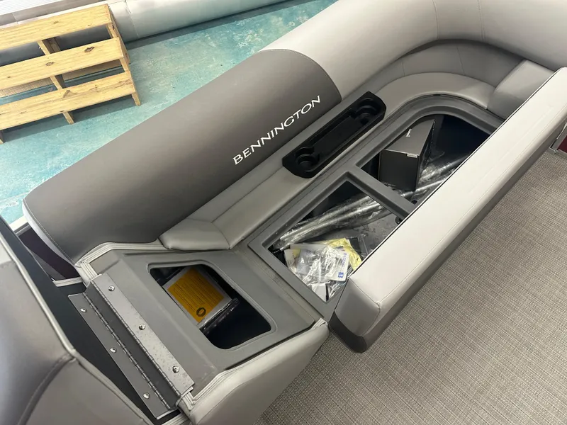 Slide: The Image of 2024 Bennington 20SVLSR boat interior storage compartment with open seating. - 12