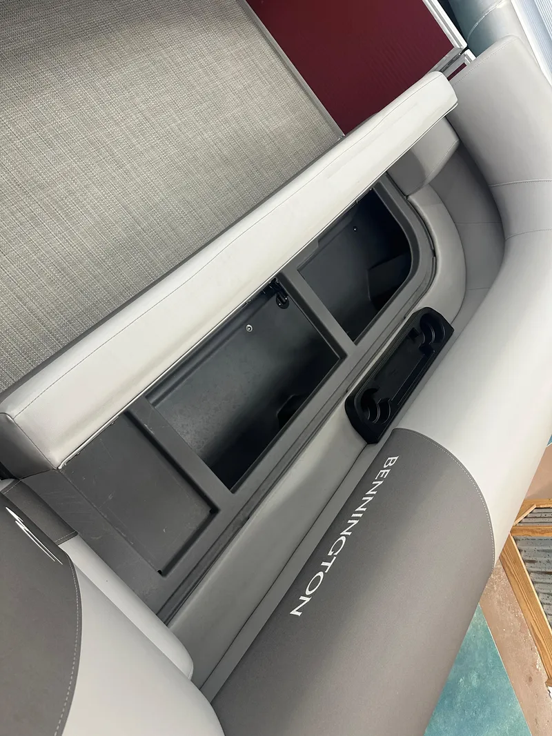 Slide: The Image of 2024 Bennington 20SVLSR boat interior with storage compartment and seating. - 15