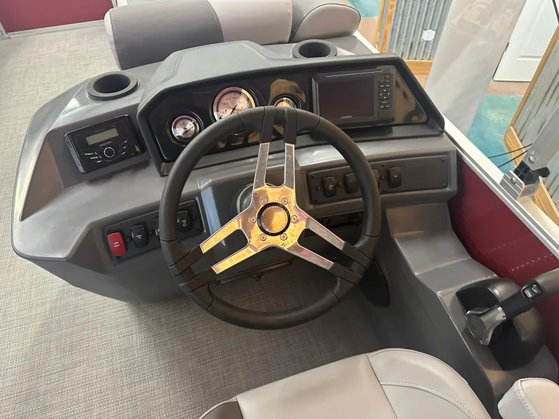 Slide: The Image of 2024 Bennington 20SVLSR boat dashboard with steering wheel and control panel. - 16