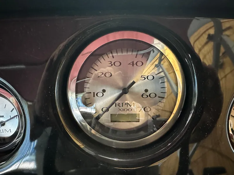 Slide: The Image of Close-up of 2024 Bennington 20SVLSR RPM gauge displaying engine speed. - 19