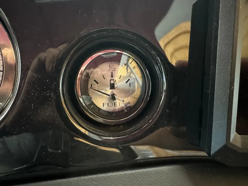 Slide: The Image of 2024 Bennington 20SVLSR fuel gauge showing near empty. - 20