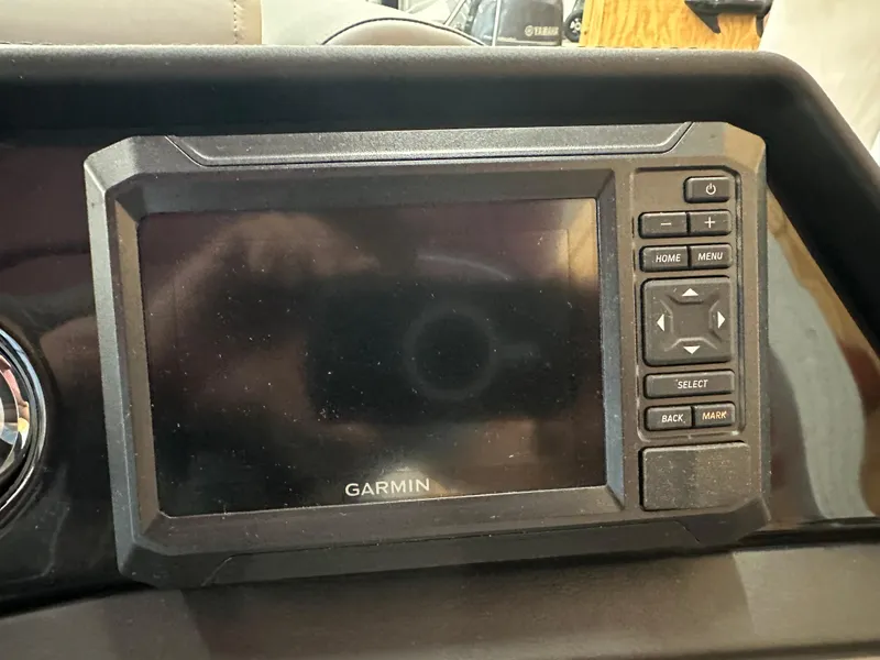 Slide: The Image of Garmin navigation system on 2024 Bennington 20SVLSR boat dashboard. - 21