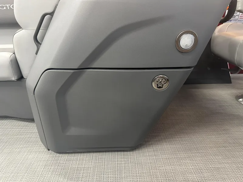 Slide: The Image of 2024 Bennington 20SVLSR boat interior detail with gray seating and storage compartment. - 31