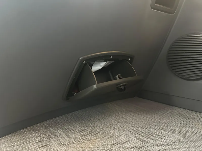 Slide: The Image of 2024 Bennington 20SVLSR interior storage compartment with speaker detail. - 36