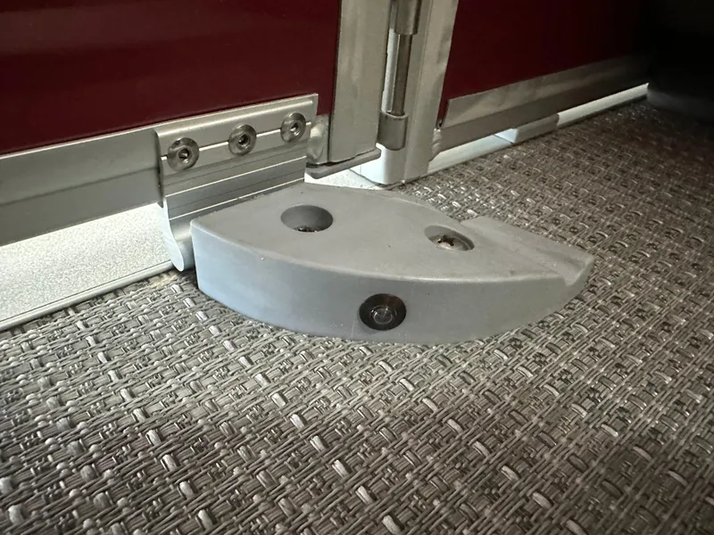 Slide: The Image of 2024 Bennington 20SVLSR boat hinge detail on woven flooring. - 37