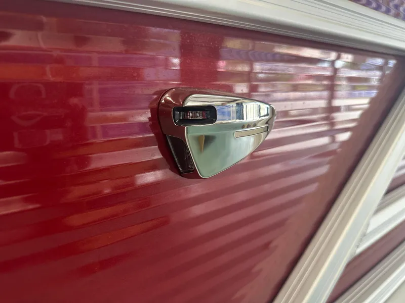 Slide: The Image of 2024 Bennington 20SVLSR boat with sleek red exterior and chrome detail. - 38