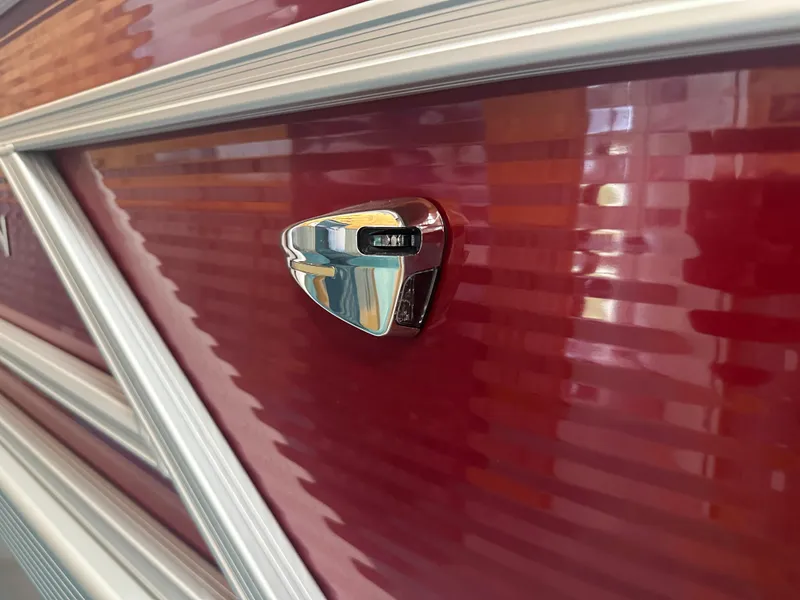 Slide: The Image of Close-up of 2024 Bennington 20SVLSR boat's sleek red exterior with chrome detail. - 40