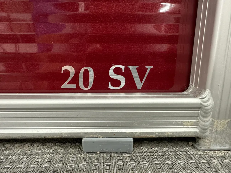 Slide: The Image of 2024 Bennington 20SVLSR boat model emblem on red background. - 5