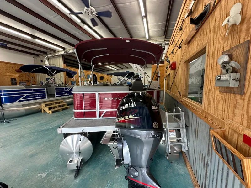 Slide: The Image of 2024 Bennington 20SVLSR pontoon boat with Yamaha outboard in showroom. - 7
