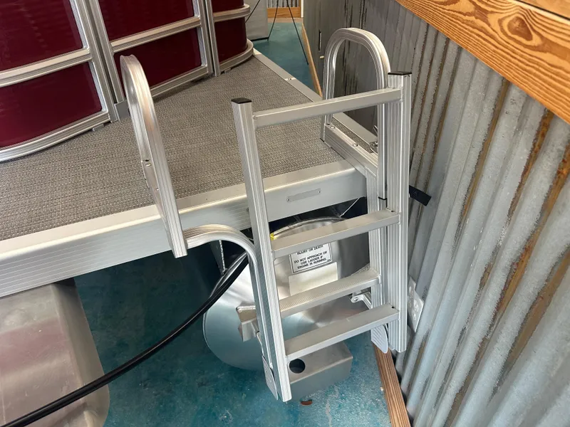 Slide: The Image of 2024 Bennington 20SVLSR pontoon boat ladder and deck detail. - 9