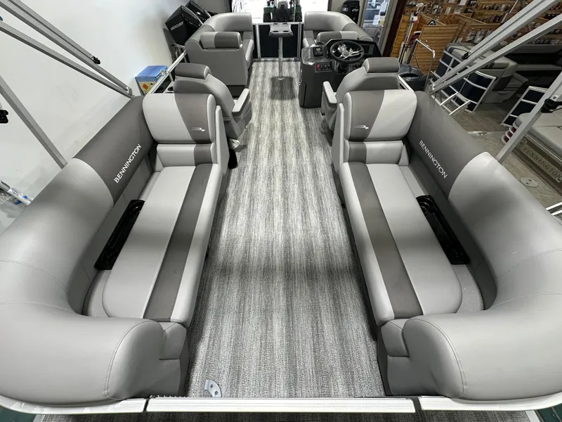 Slide: The Image of 2025 Bennington 22SSRSE pontoon boat interior with gray seating and modern design. - 13