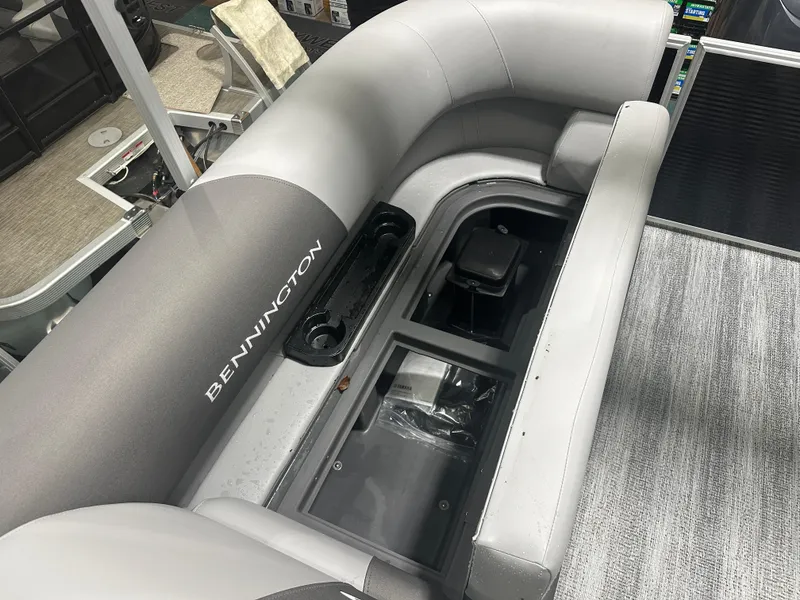 Slide: The Image of 2025 Bennington 22SSRSE boat interior with open storage compartment. - 20