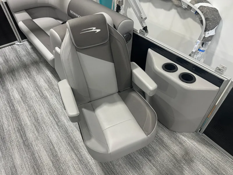 Slide: The Image of 2025 Bennington 22SSRSE boat interior with gray seating and cup holders. - 23