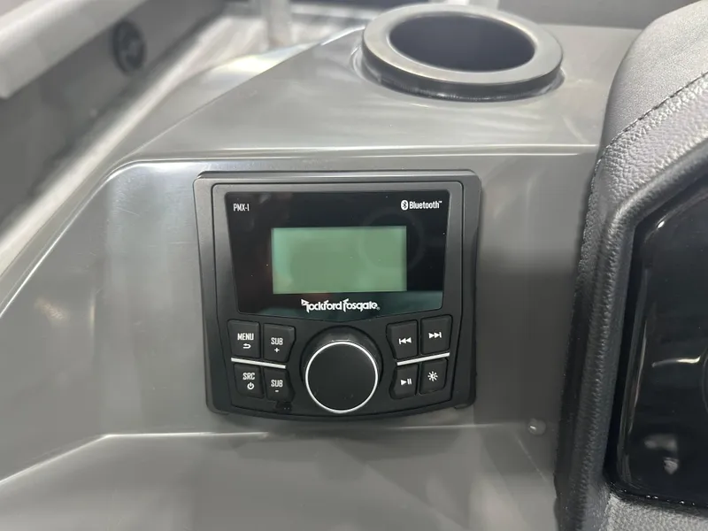 Slide: The Image of Rockford Fosgate Bluetooth stereo on 2025 Bennington 22SSRSE boat dashboard. - 26