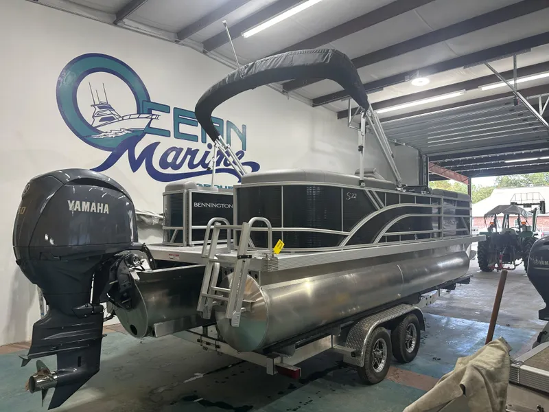Slide: The Image of 2025 Bennington 22SSRSE pontoon boat with Yamaha engine in showroom. - 6