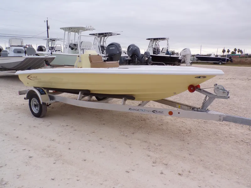 Slide: The Image of 2024 K2 Powerboats 17HS on trailer, parked outdoors, with other boats in the background. - 1