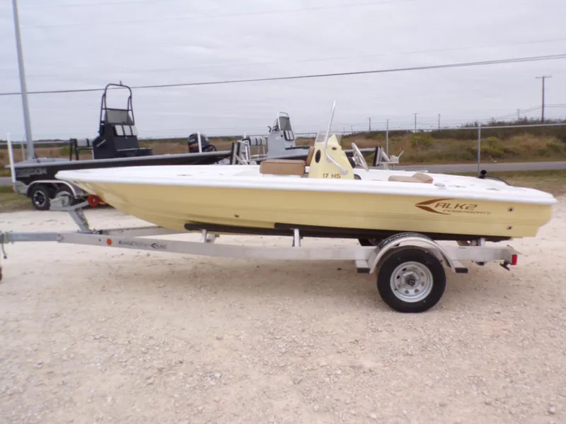 Slide: The Image of 2024 K2 Powerboats 17HS on trailer, yellow hull, parked outdoors. - 19