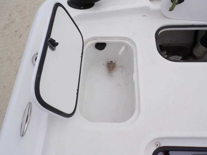 Slide: The Image of Open storage compartment on 2024 k2 Powerboats 17HS, showcasing interior details. - 7