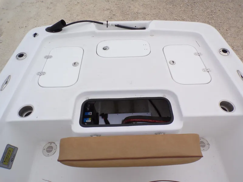 Slide: The Image of 2024 K2 Powerboats 17HS deck with storage compartments and seating. - 8