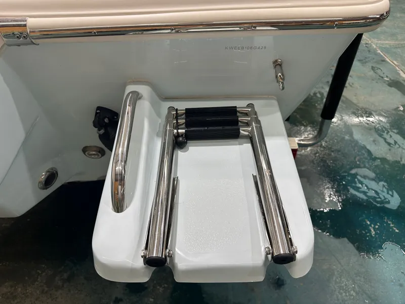 Slide: The Image of 2025 Key West 230BR boat swim platform with foldable ladder, stainless steel details. - 13