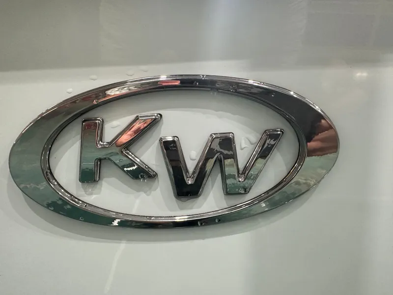 Slide: The Image of Chrome "KW" logo on 2025 Key West 230BR boat. - 19