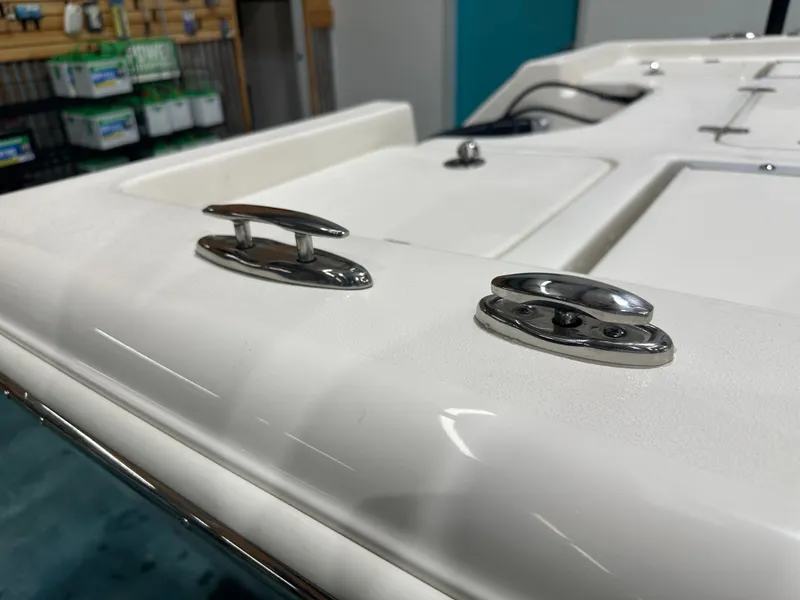 Slide: The Image of 2025 Key West 230BR boat deck with stainless steel cleats in a showroom. - 20