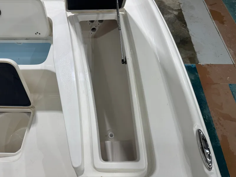 Slide: The Image of Open storage compartment on a 2025 Key West 230BR boat, showcasing interior details. - 43