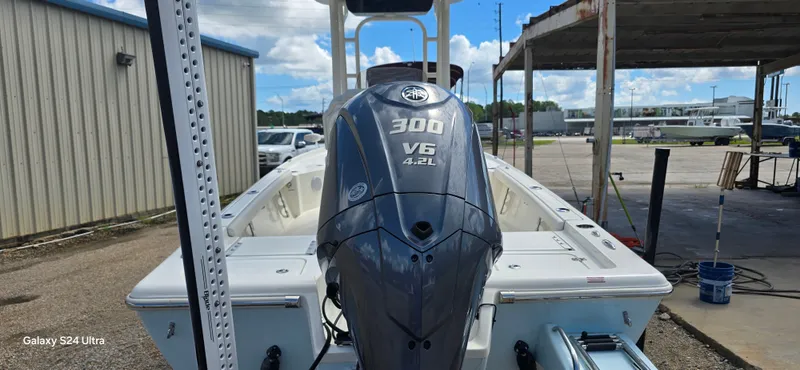 Slide: The Image of 2025 Key West 230BR boat with Yamaha 300 V6 engine, parked outdoors. - 5